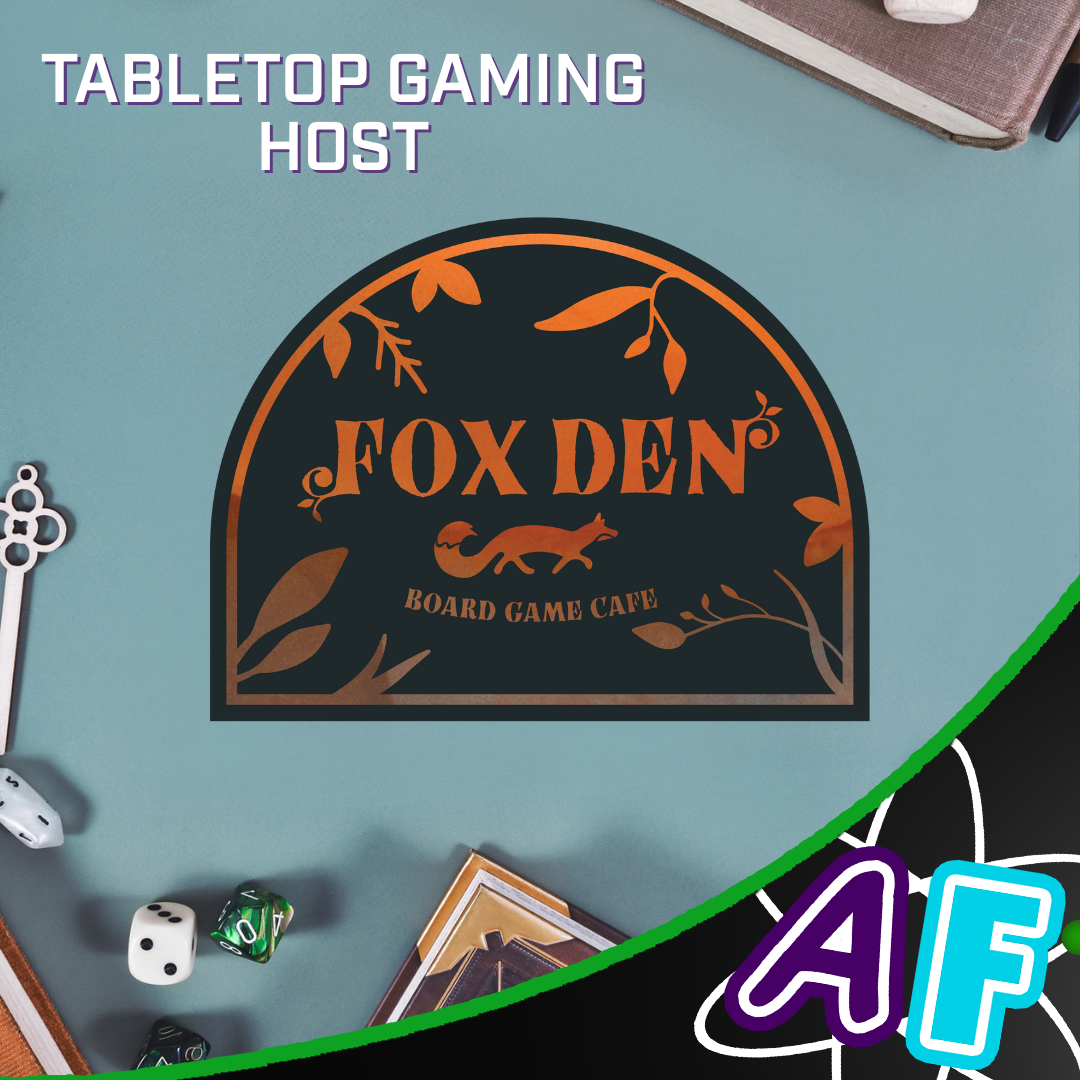 Image of a table with board game paraphernalia as background, with the Fox Den logo in the middle. Text on the photo reads "Tabletop gaming host"