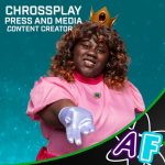 A woman with dark curly hair cosplaying Princess Peach from Mario, with her hand outstretched toward the viewer. She is composited onto a blue sparkling background. Text on the image says: "Chrossplay Press and media CONtent Creator"