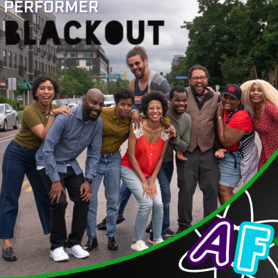 A group of performers posing and smiling at the camera. Text on the photo reads: "Performer: Blackout" with the comedy troupe's logo serving as the text